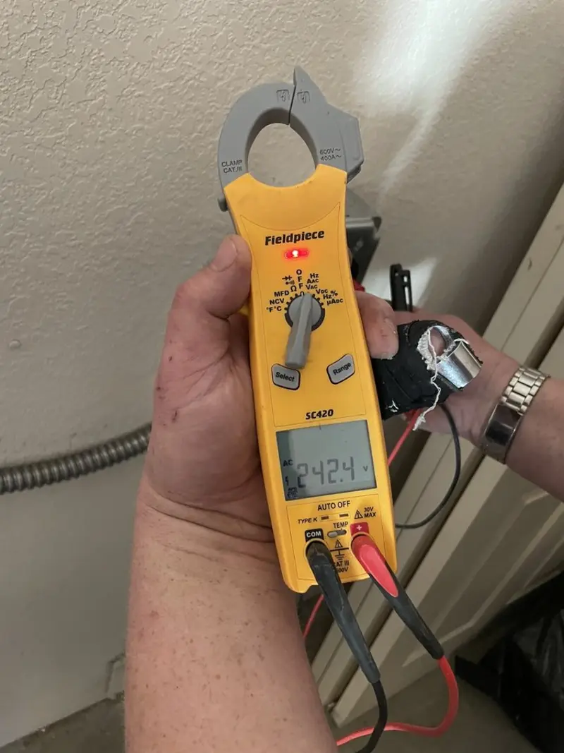 Voltage testing with clamp meter during Whole House Surge Protector in Mansfield